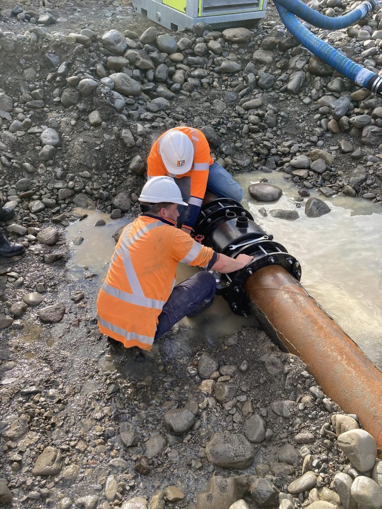 Workers Implementing the Tauherenikau River Pipe Fitting Repair Work