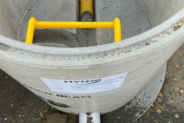 Laser set inside the Perfect Manhole channel to set grade